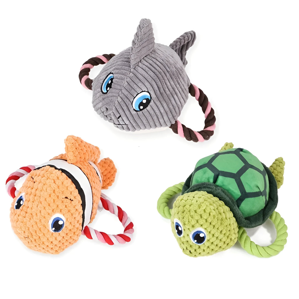 Grey, green, and orange turtle-shaped plush dog toy with a knotted rope chewing core