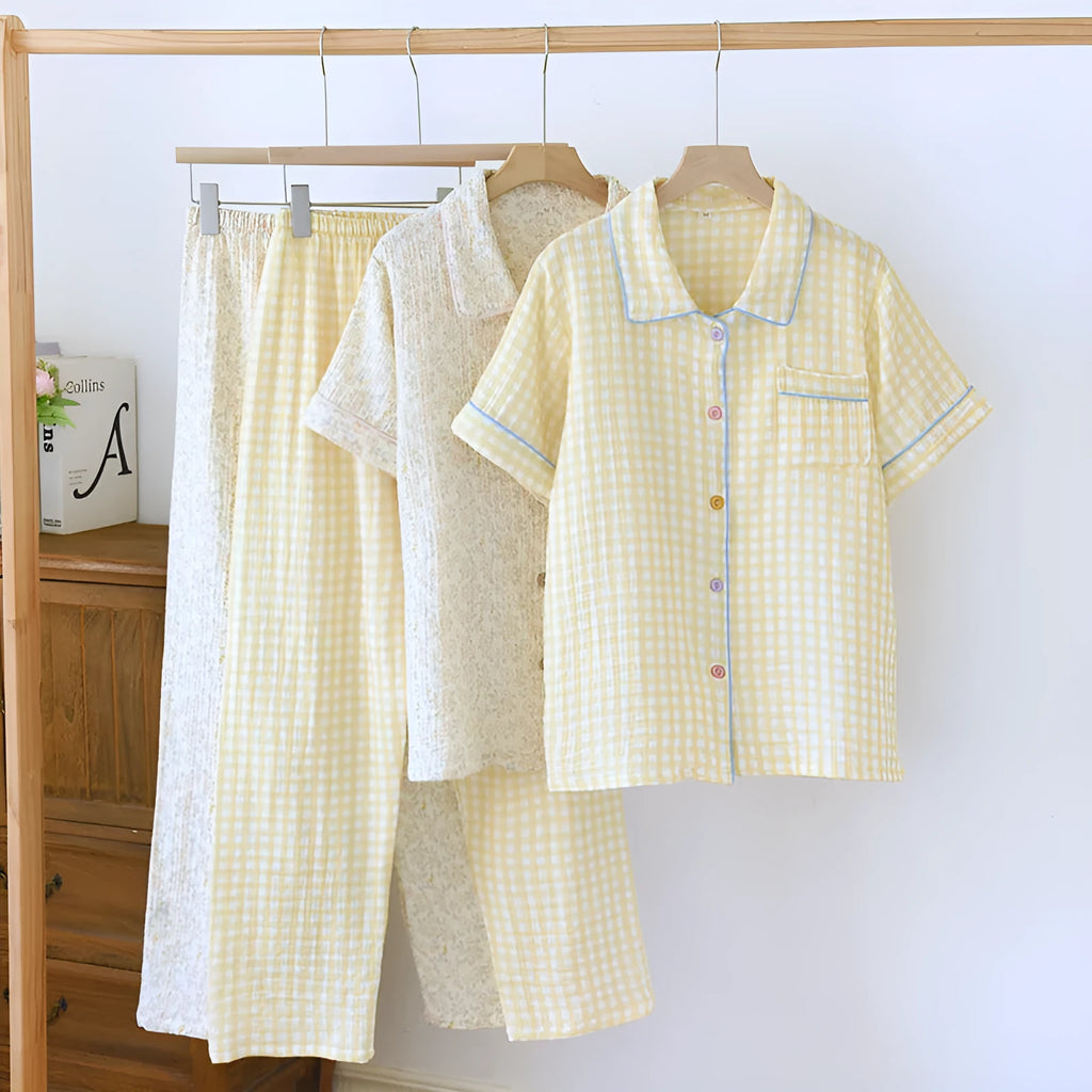 Washed cotton short-sleeved top and trousers set in a floral or plaid pattern, laid flat.