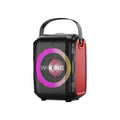 Black Bluetooth speaker with cool light circle in horizontal position on table