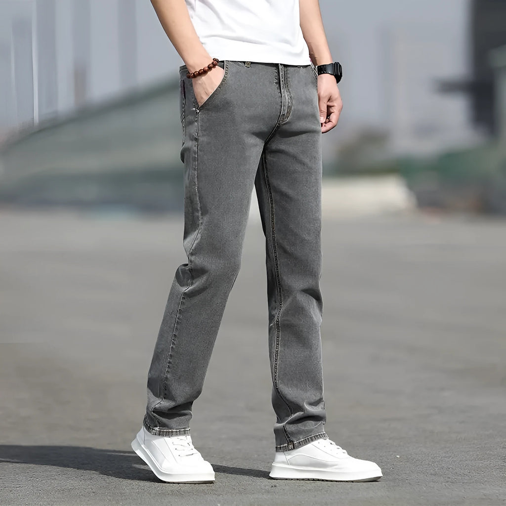 Men's smoky gray straight leg jeans with high elasticity rabbit fur fabric on low waist mannequin