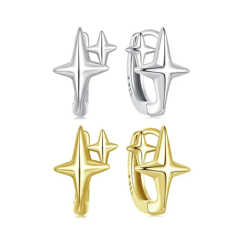 Close-up of a pair of oxidised sterling silver clip-on earrings featuring a minimalist star motif.