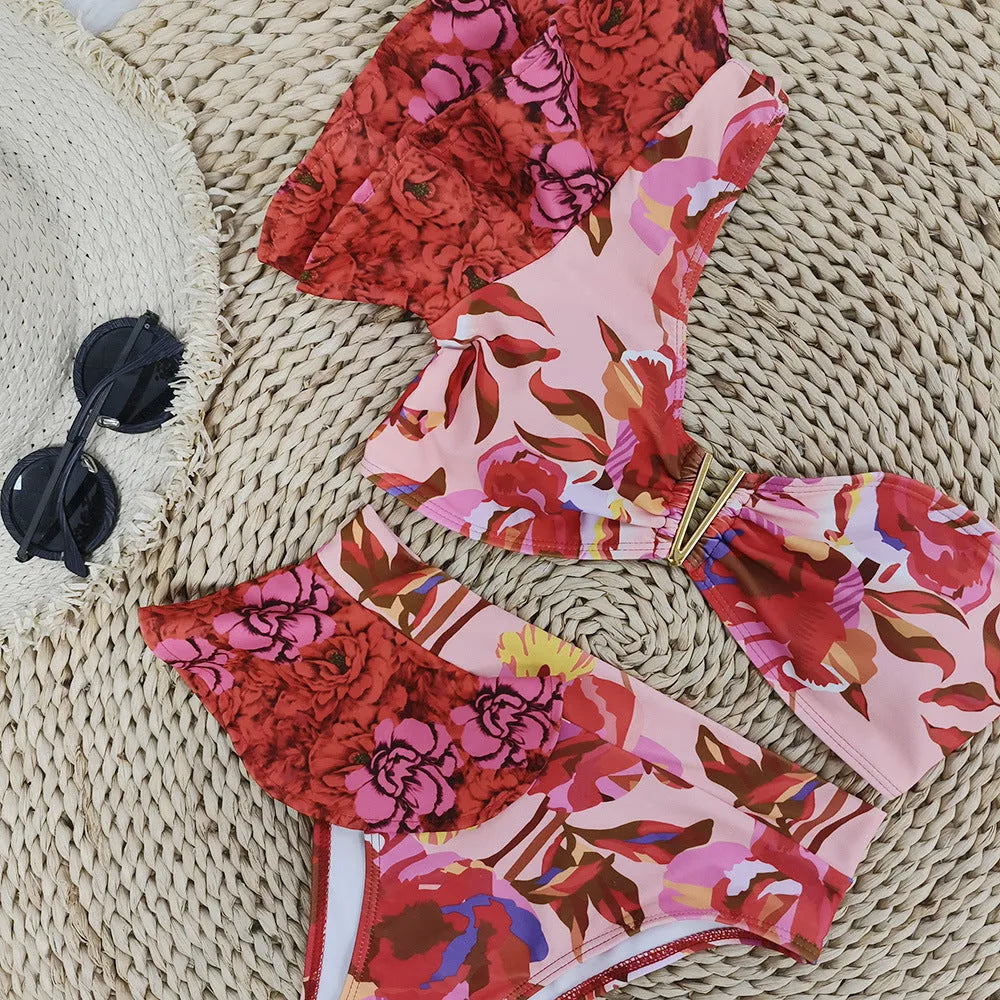 Women's one-shoulder ruffled floral print bikini set with high-waisted briefs in pink and red colours