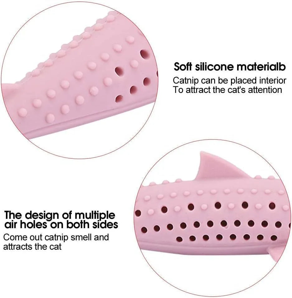 Green silicone fish-shaped cat chew toy with side holes on a white background