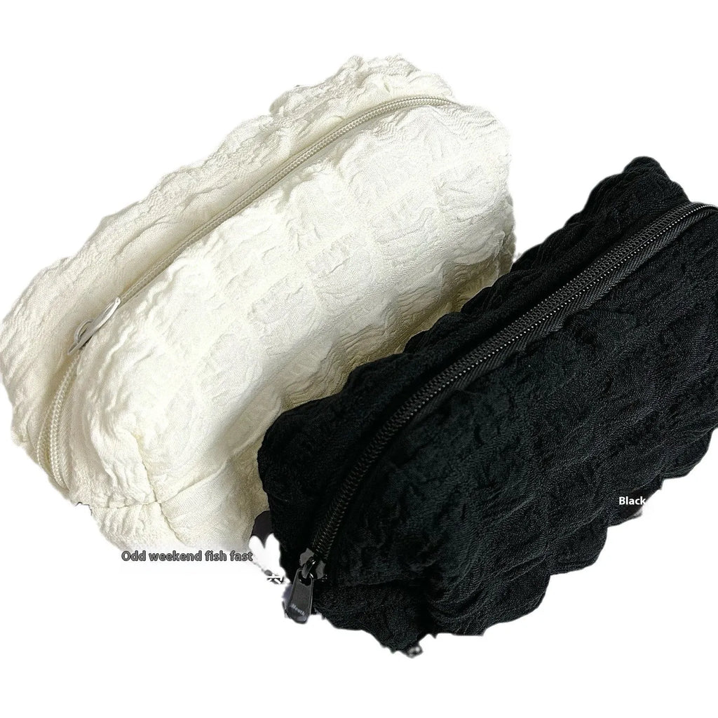 Cream puff style polyester fabric pencil case in beige colour with zip closure