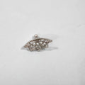 Spider web design stud earrings in gold and silver electroplated metal.