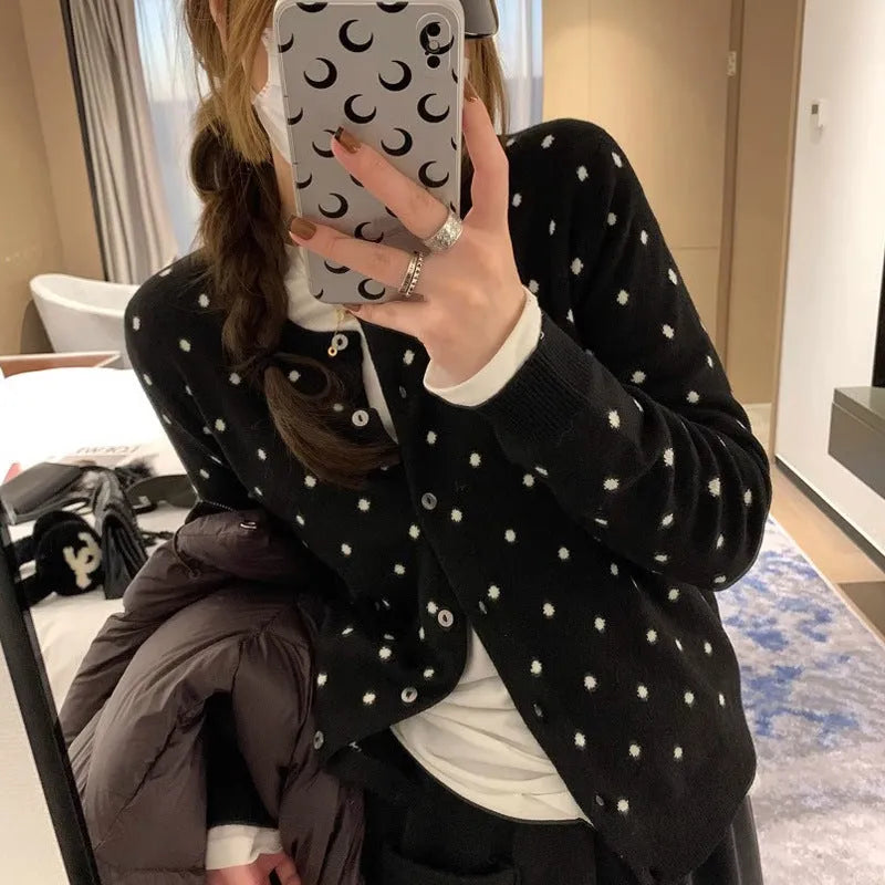 Women's grey dot knitted cardigan with crocheted flower detail and long sleeves