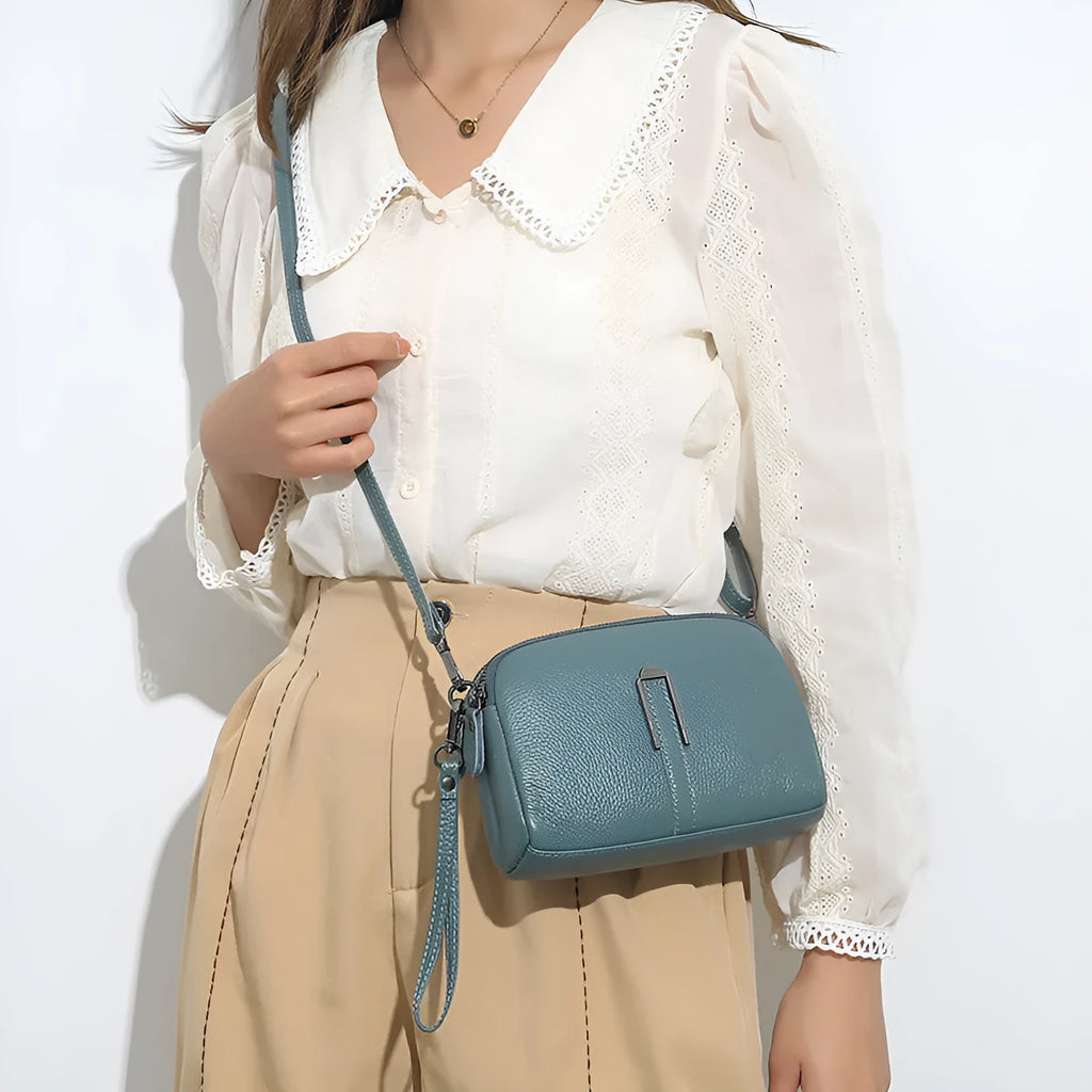 Genuine cowhide leather women's shoulder bag in horizontal square shape, 19x13x6cm, shown in a neutral colour.