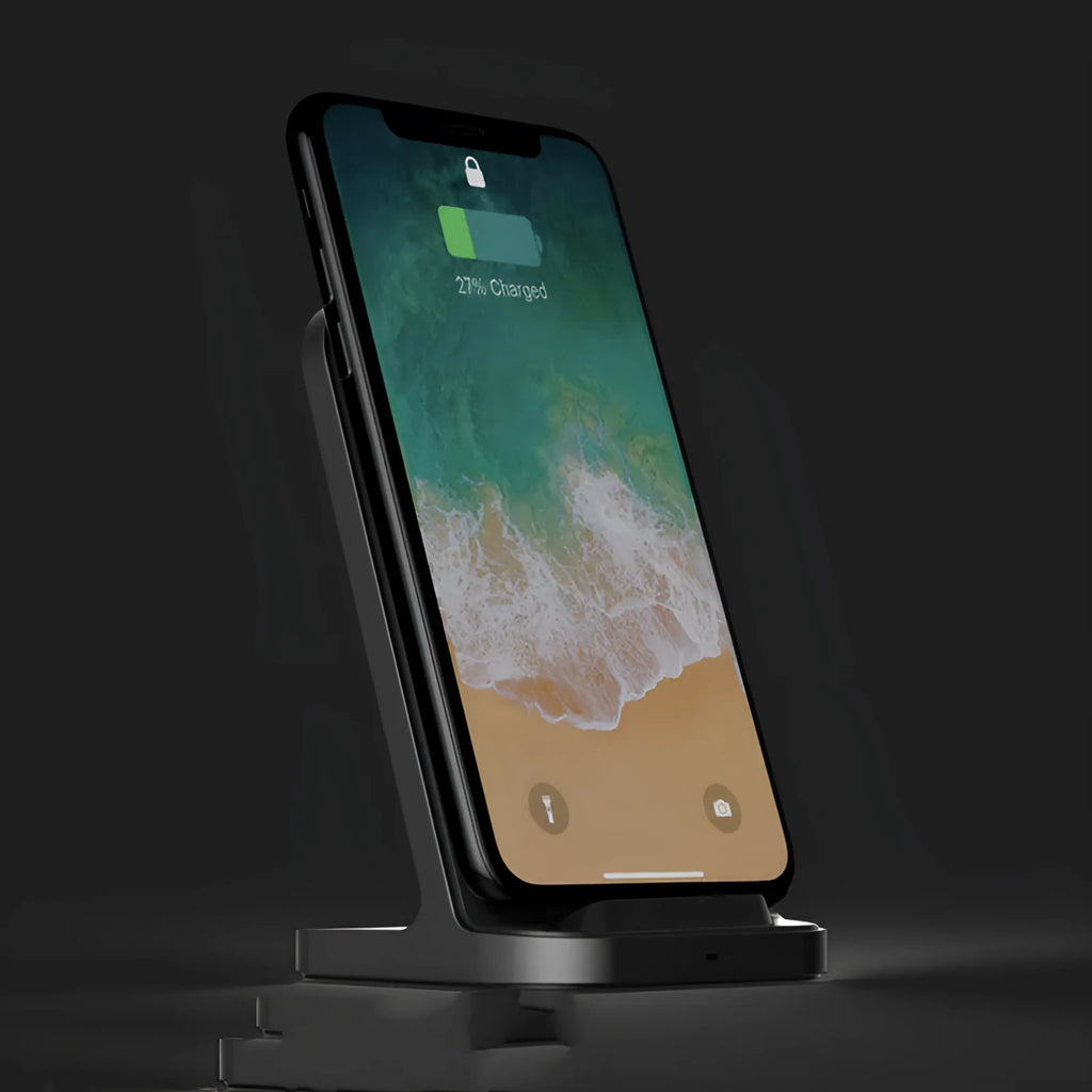 Dark grey vertical wireless charging stand for Apple iPhones on desk