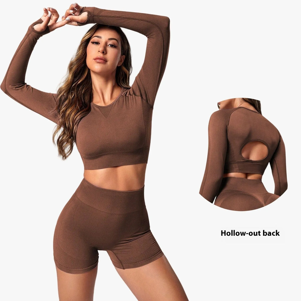 Women's black yoga clothing set with long sleeve top and high-waisted leggings