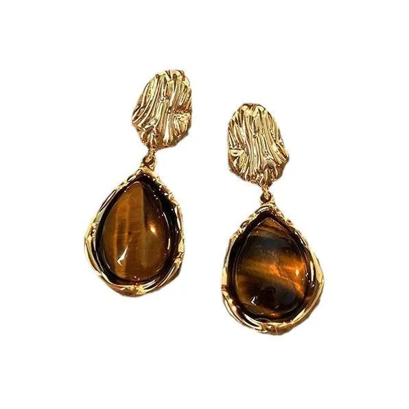 Three pairs of geometric alloy earrings with electroplated finishes in irregular amber, wafer round, and water drop tassel styles