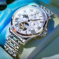 Men's 7013 automatic mechanical watch with double calendar dial and steel strap on white background