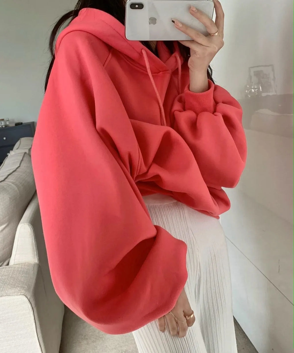 Watermelon red women's silk hooded sweater on hanger showing sleeveless design