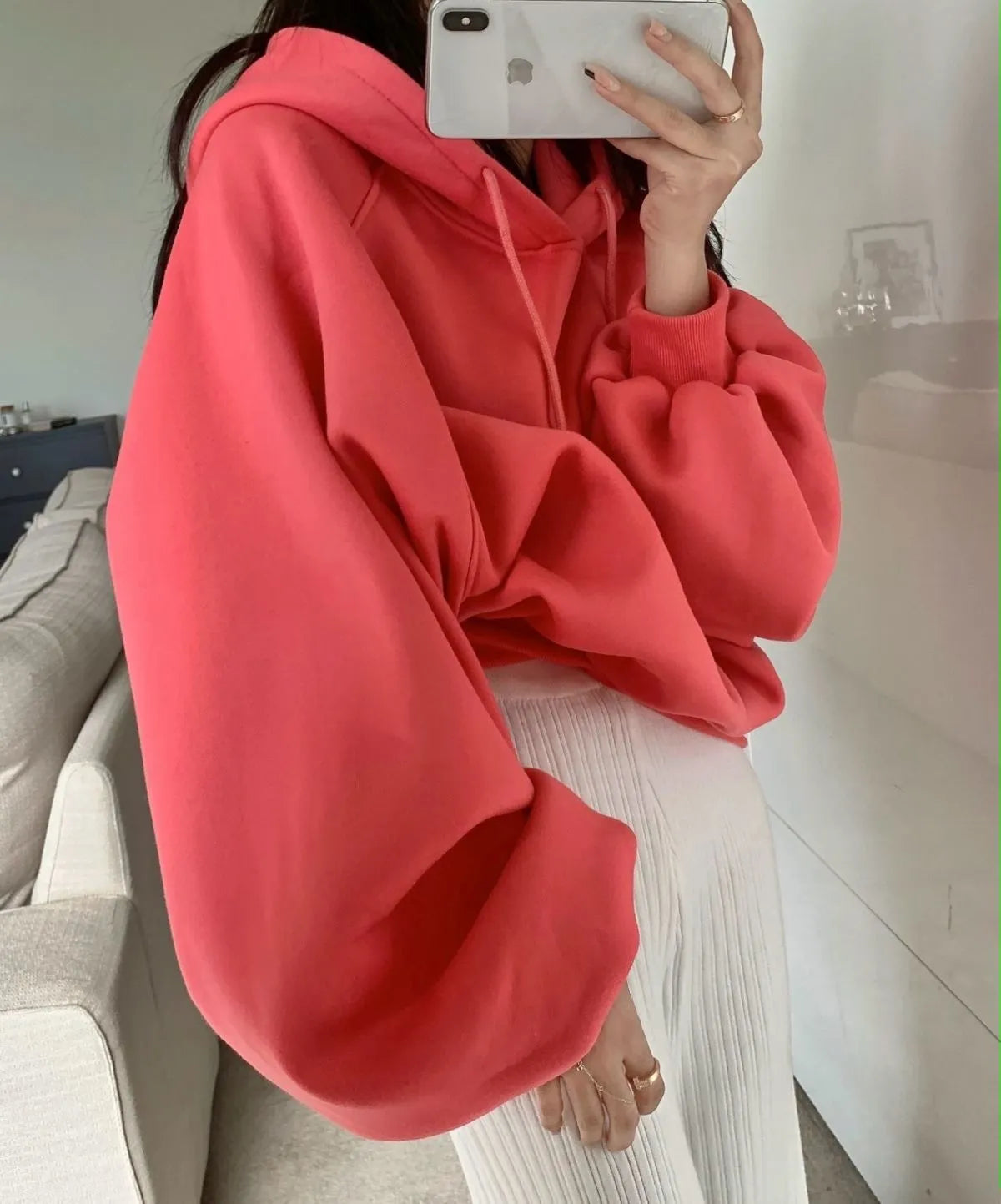 Watermelon red women's silk hooded sweater on hanger showing sleeveless design