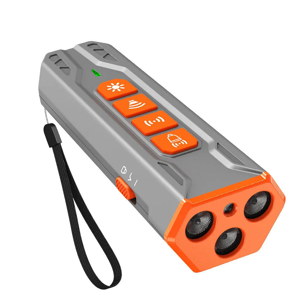 Handheld ultrasonic dog trainer with three sound heads in black and orange ABS plastic.