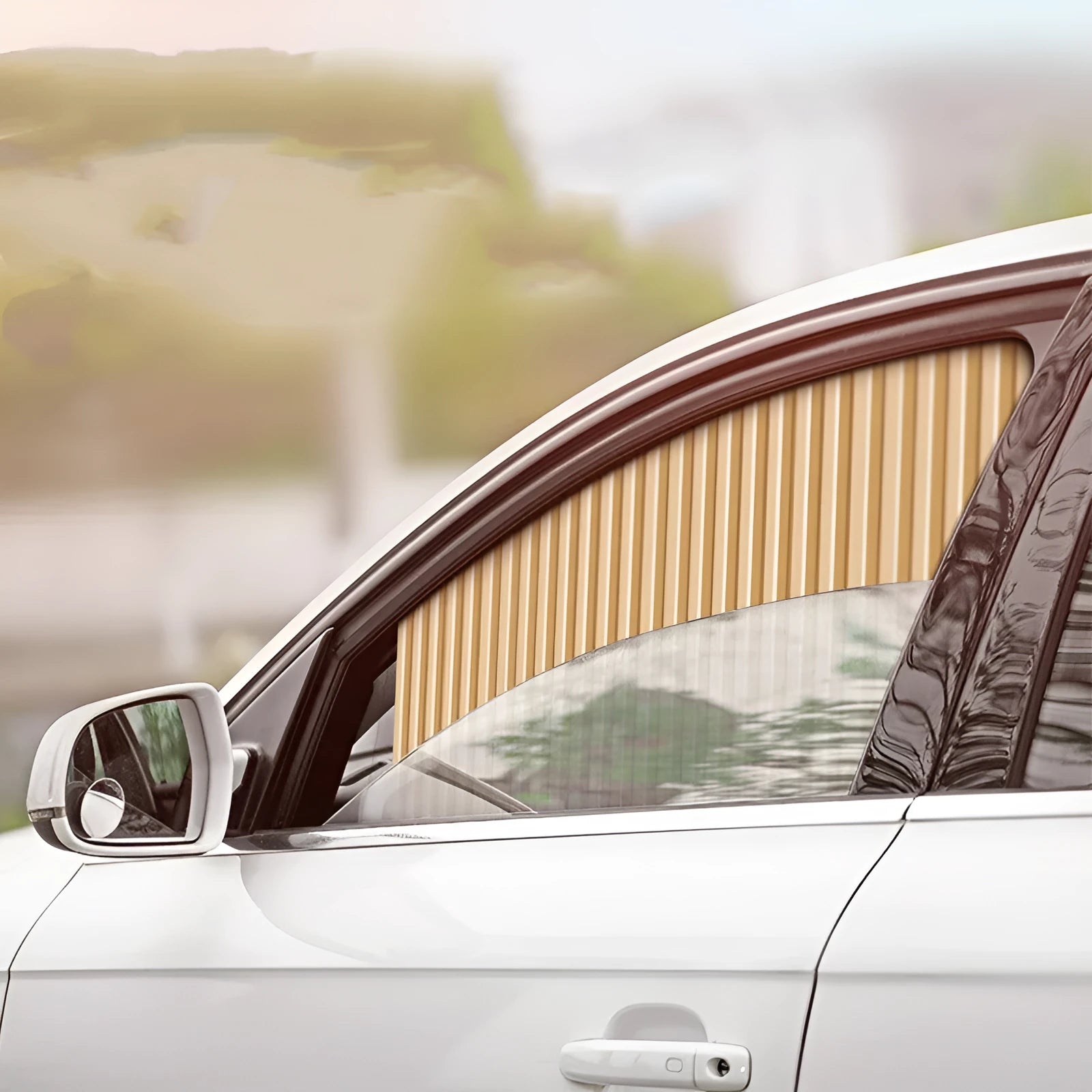 Retractable car sunshade curtain in black showing roller mechanism and opaque cloth material