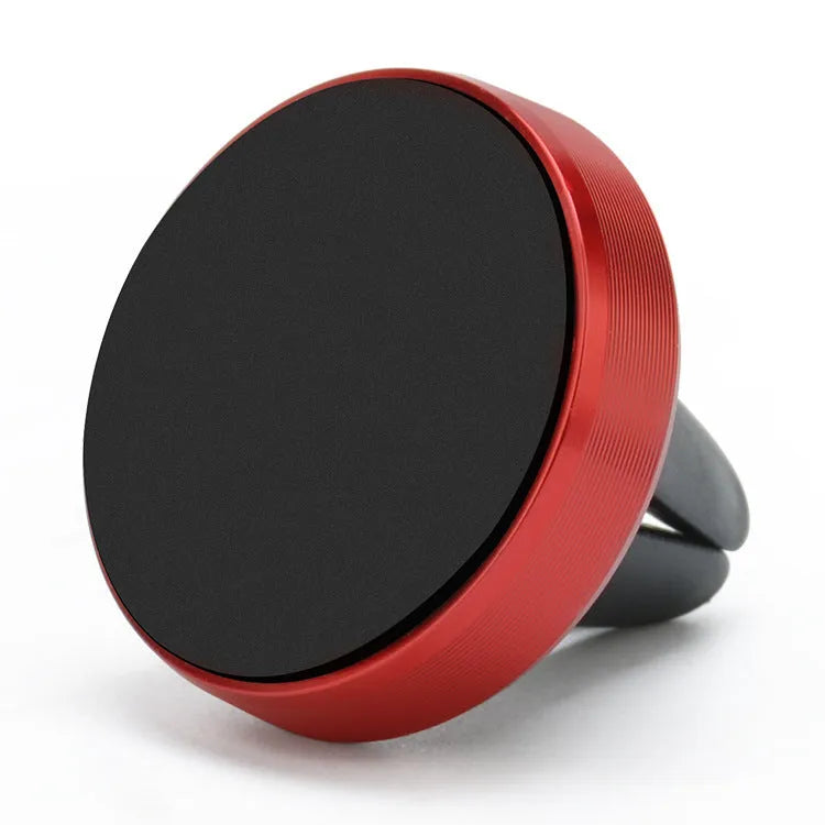 A compact metal magnetic phone holder clipped to a car air vent.