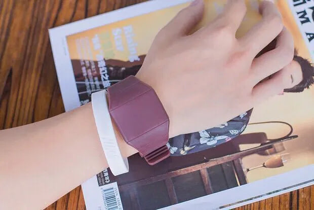 Square white electronic touch screen watch with digital display on a black PU strap and stainless steel buckle