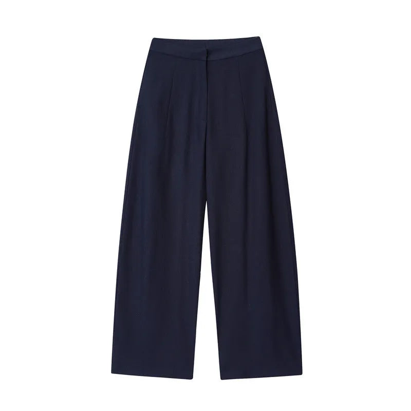 Women's linen blend co-ord set showing flounced sleeve off-neck top with wide leg trousers in temperament commute style