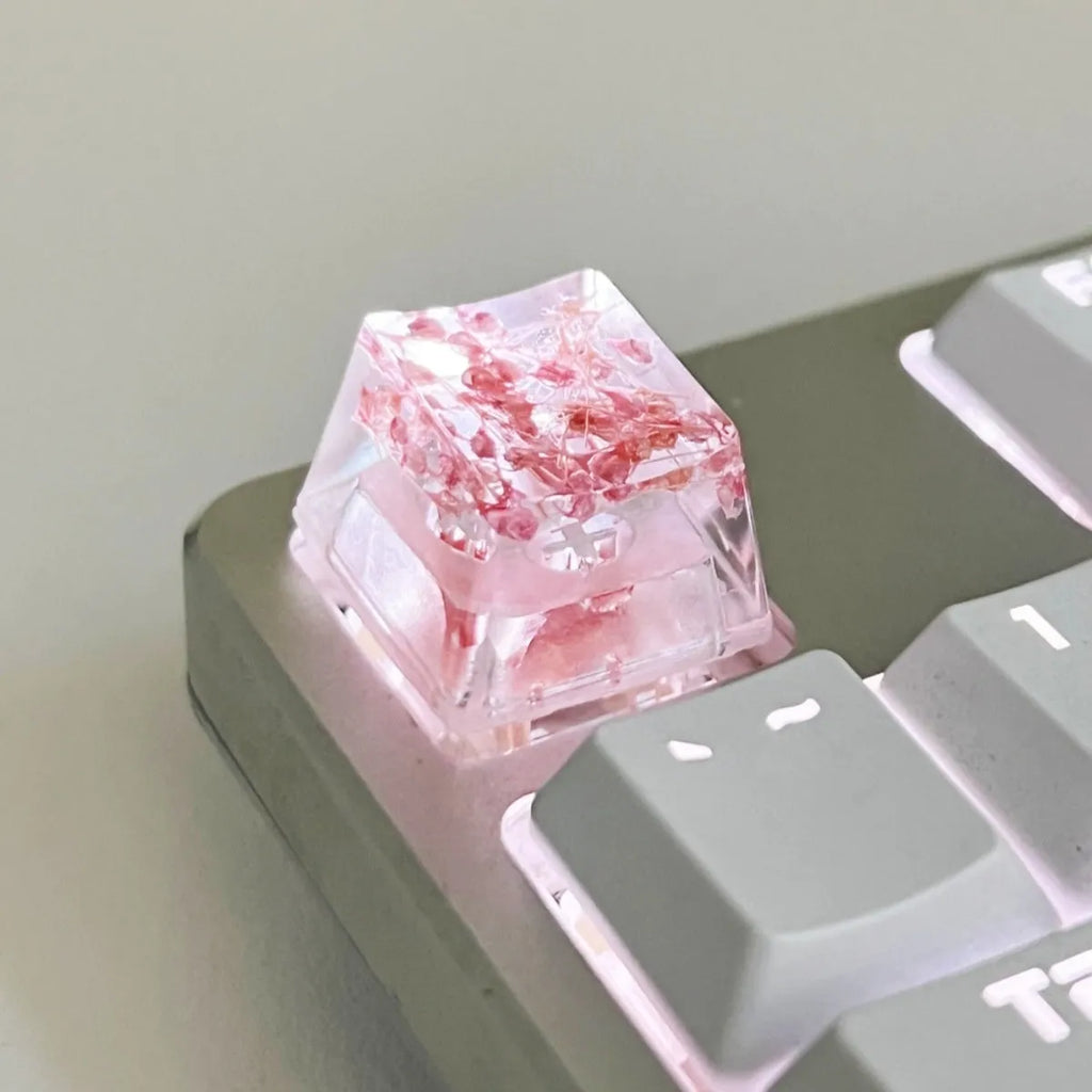Green resin transparent keycap with glitter starry sky design for mechanical keyboards.
