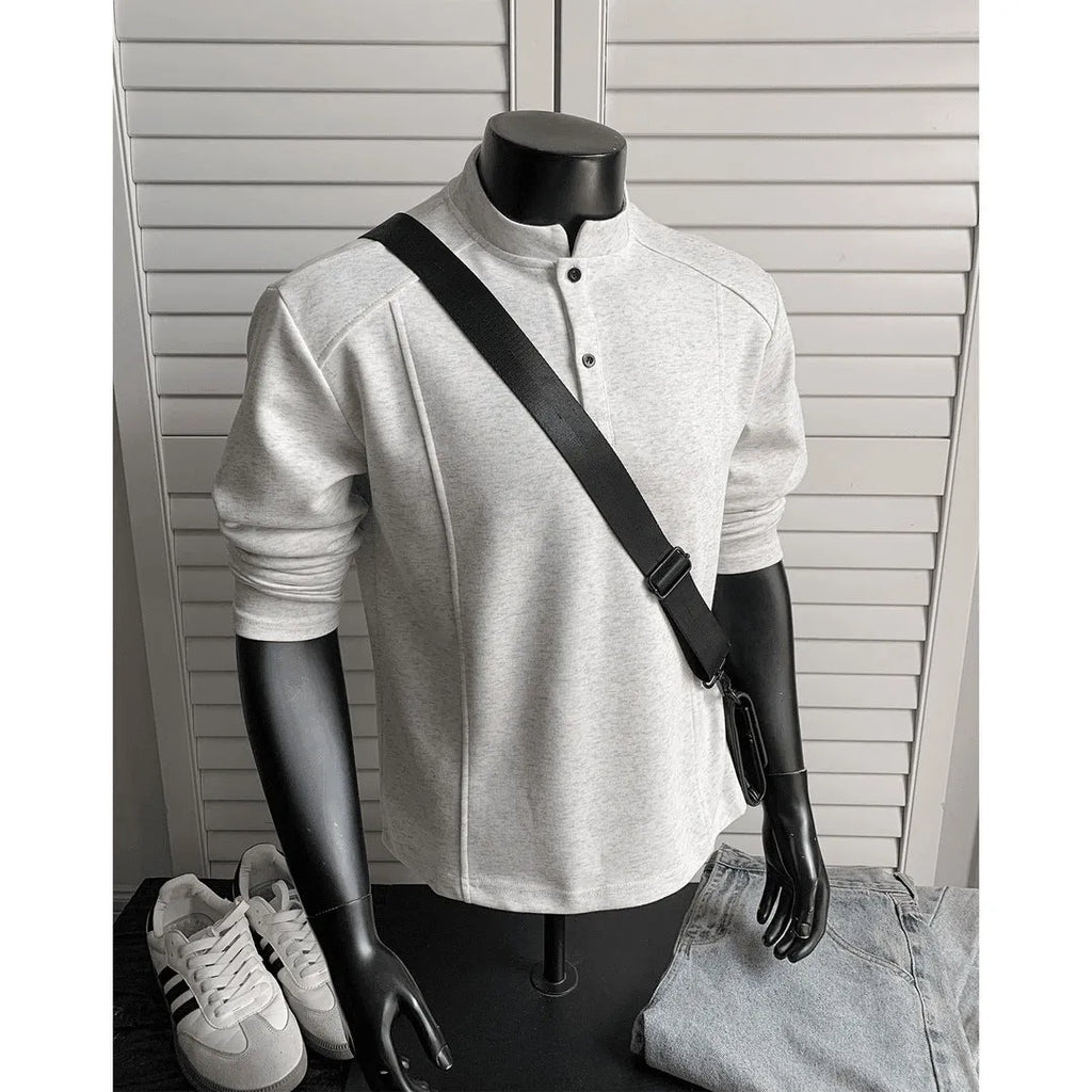 Men's long sleeve polo shirt with stand-up collar and asymmetric patchwork design in loose fitting style