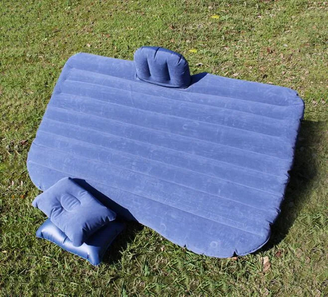 Black inflatable car bed with flocked surface, two pillows, and storage bag for five-seater vehicles
