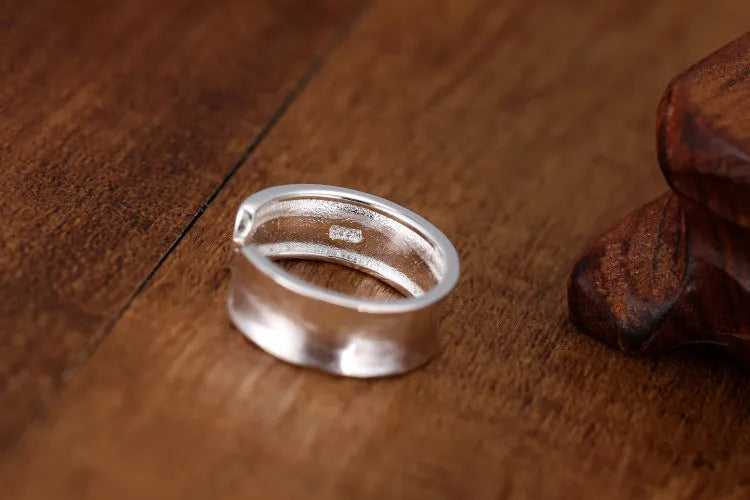 Geometric open ring with frosted sterling silver finish and adjustable opening design