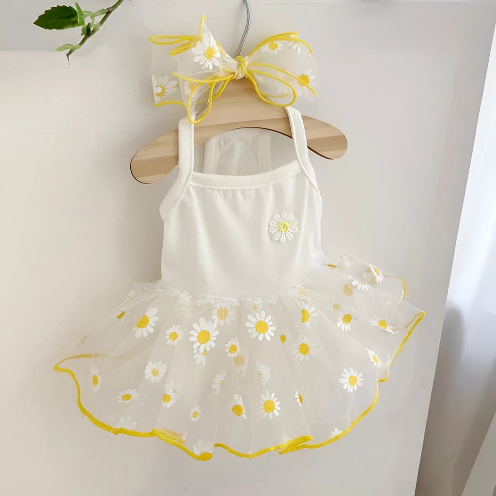 Yellow daisy pattern thin polyester dog clothes on a pet, showing summer apparel fit.