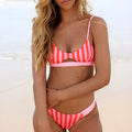Women's polyester bikini swimsuit in black and white dots or red and white stripes patterns