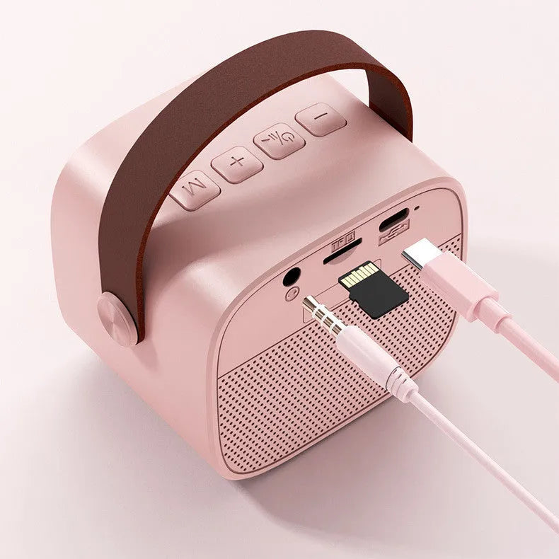 Compact portable Bluetooth speaker with microphone in white, pink, or blue colour options