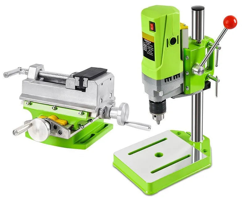 Mini bench drill and milling machine with heavy-duty cross bench pliers on workshop bench