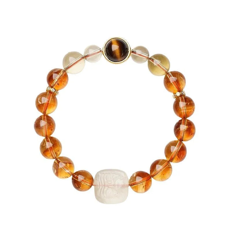 Women's ethnic style bracelet with a carved 10mm citrine crystal geometry bead.