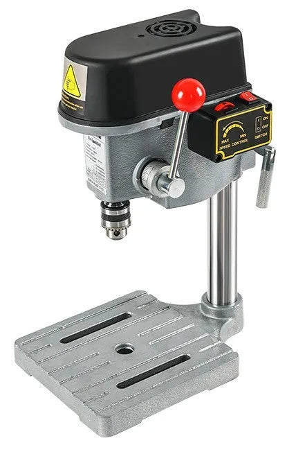 Mini bench drill and milling machine with heavy-duty cross bench pliers on workshop bench
