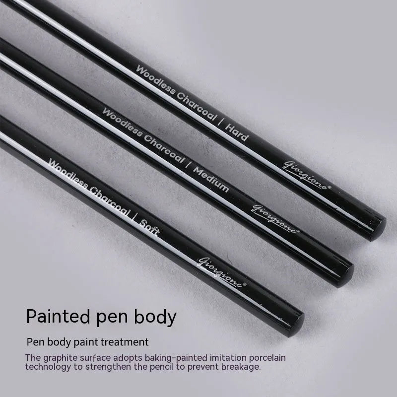 Set of nine wooden drawing pencils with six graphite and three carbonized pencils on suction card packaging