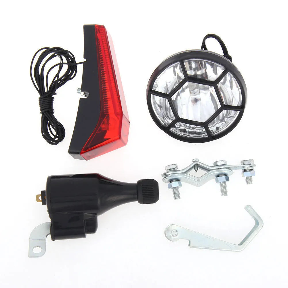 Silver bicycle dynamo light kit for front fork mounting with friction generator