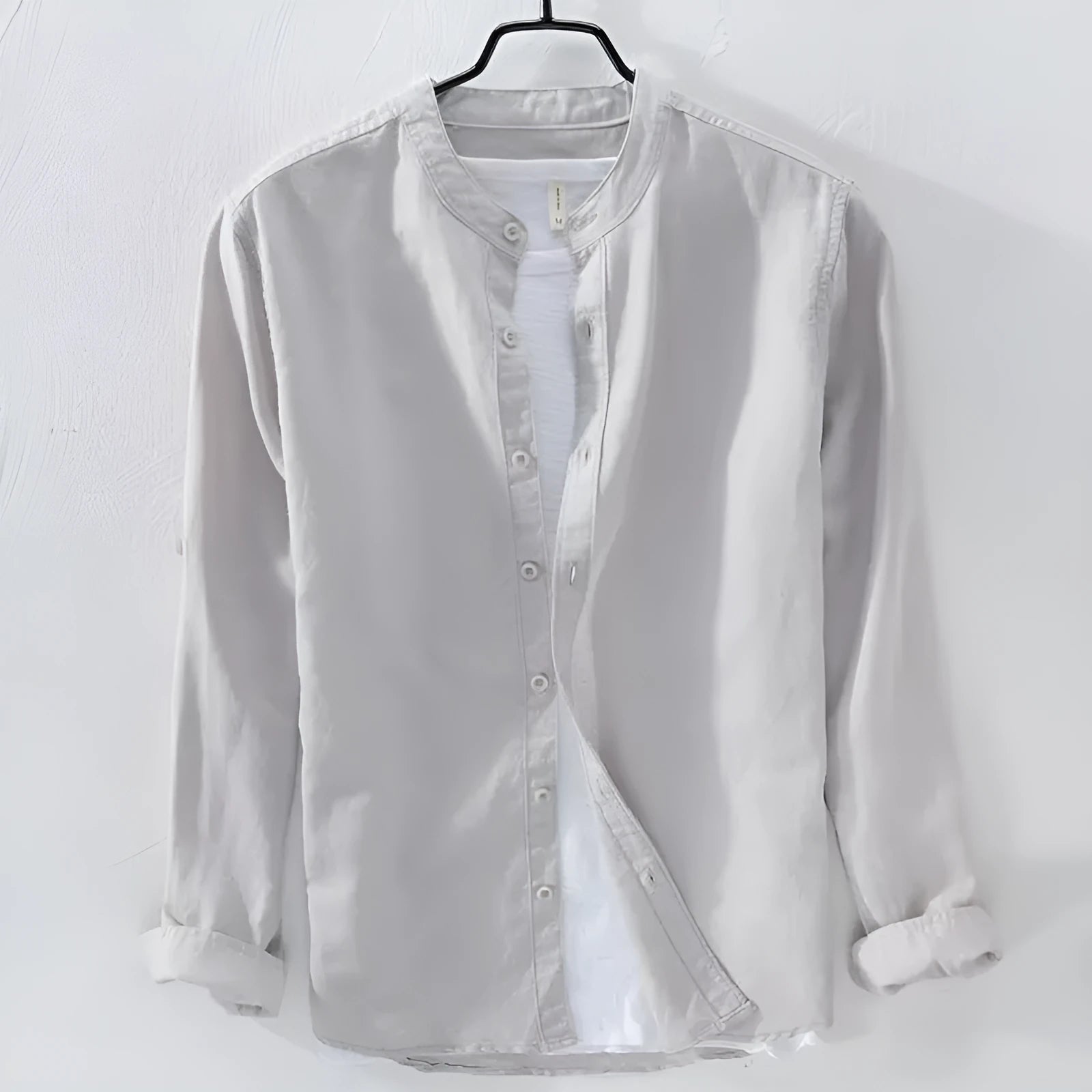 Men's loose fit long sleeve linen cotton shirt in solid colours on a hanger