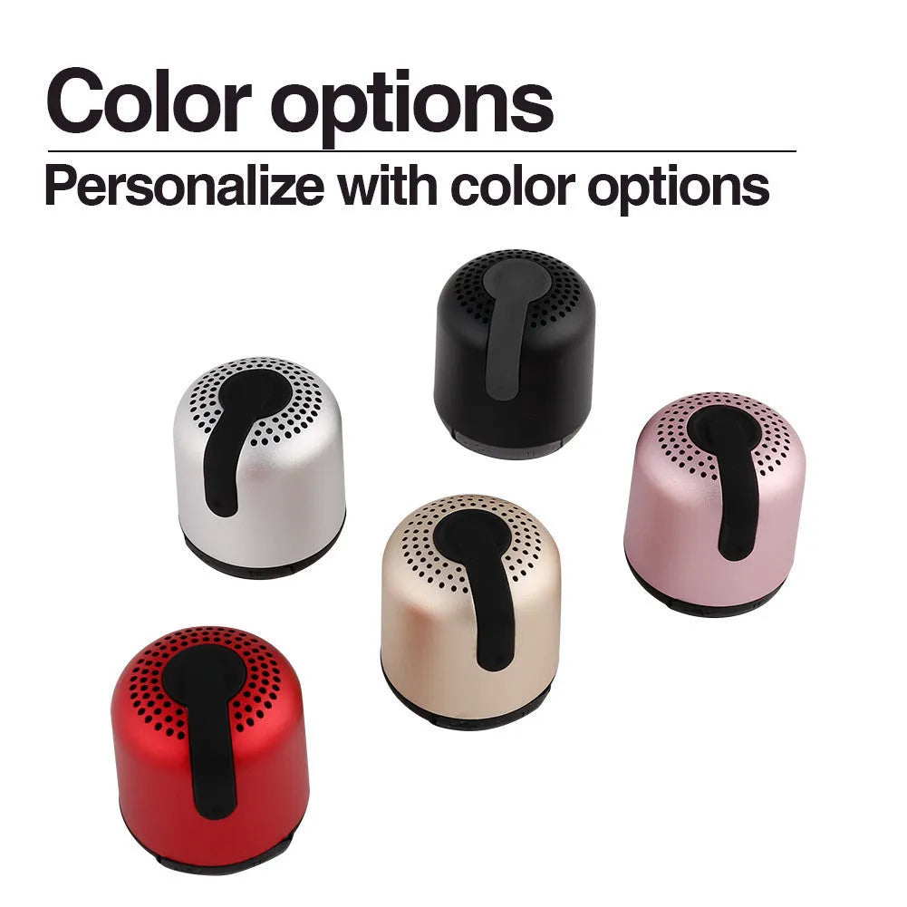 Hieha XQ11 cylindrical mini Bluetooth speaker in silver colour on a table