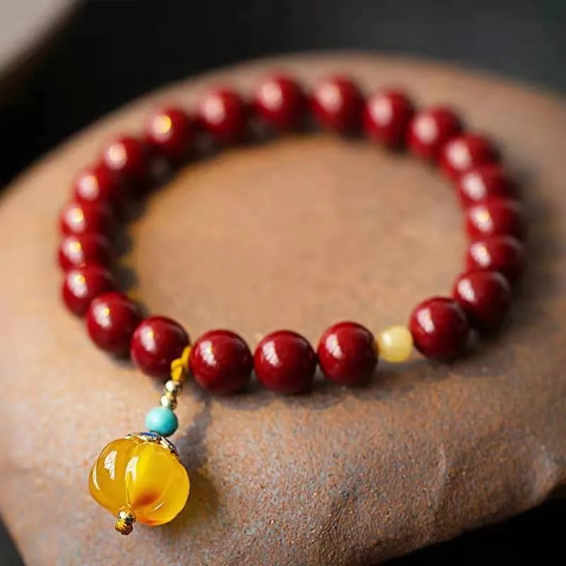 Handmade wave-shaped cinnabar and copper bead bracelet in national style.