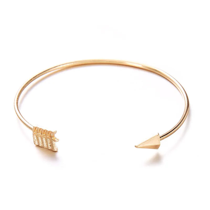 Gold vintage cuff bracelet with knotted arrow design for women