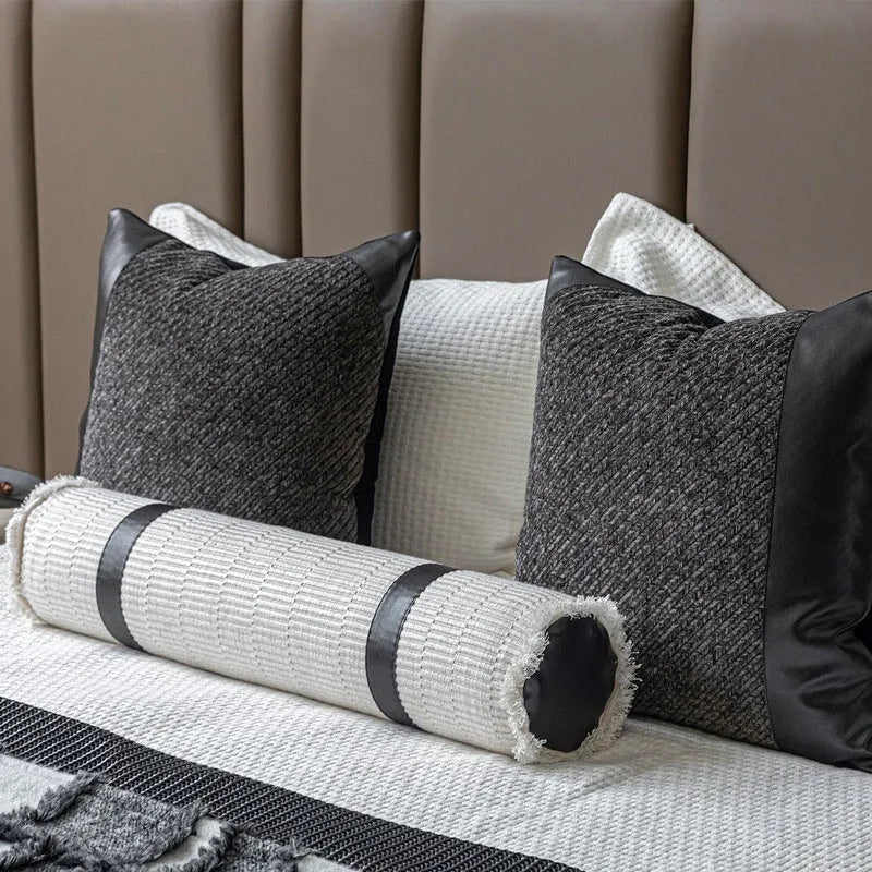 Modern grey and white plaid bed runner blanket set with a pillowcase and leather round pillow on a 1.5m bed.