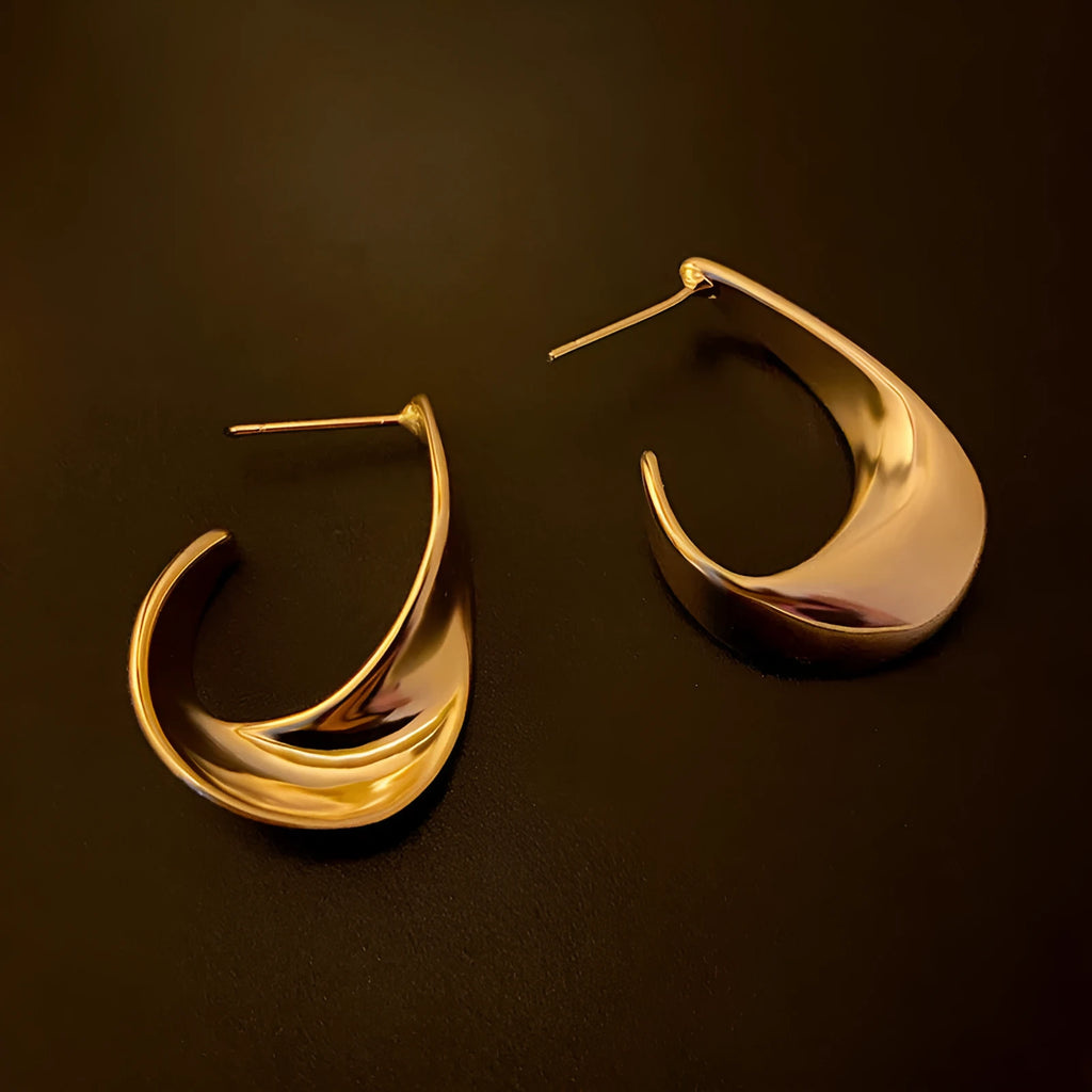 Metal twisted geometric earrings with electroplated gold silver finish and round shape
