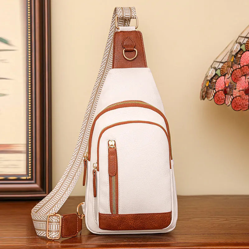Women's soft brown PU chest bag with crossbody strap and open front pocket.