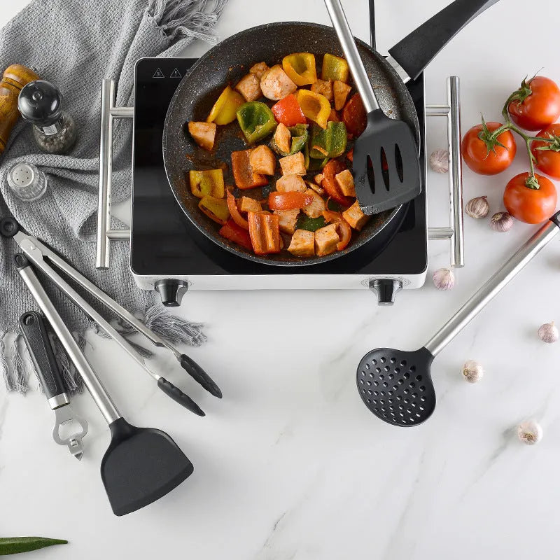 Black silicone and stainless steel cooking utensil set with 16 pieces including spatulas and spoons.