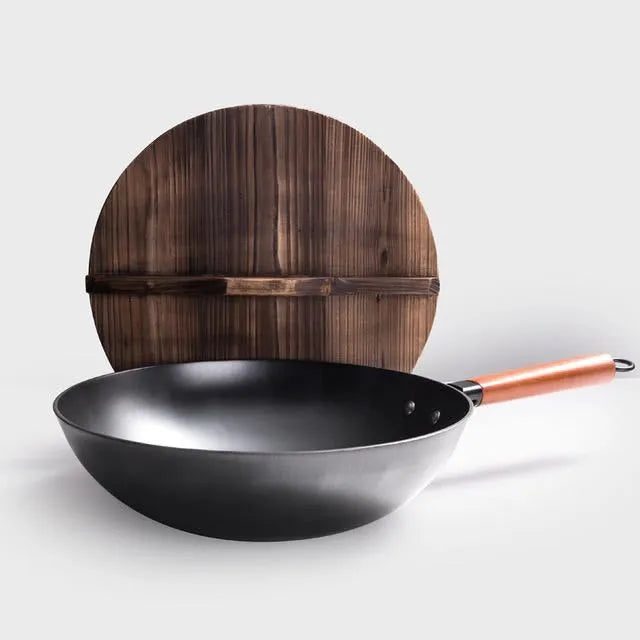 Traditional black iron wok with wooden handle measuring 32cm cooking surface diameter