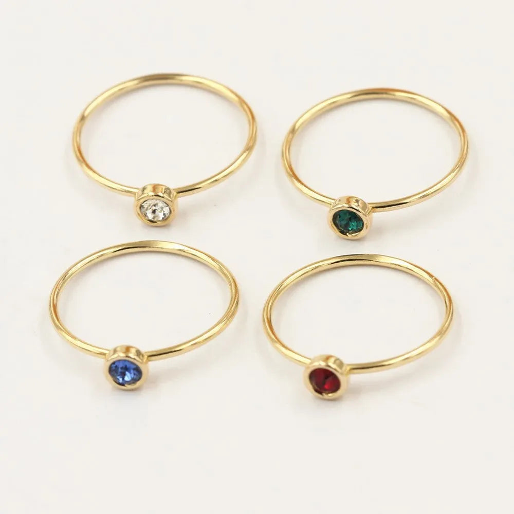 Women's 14K gilded copper zircon ring in green, blue, dark red, and white colour options.