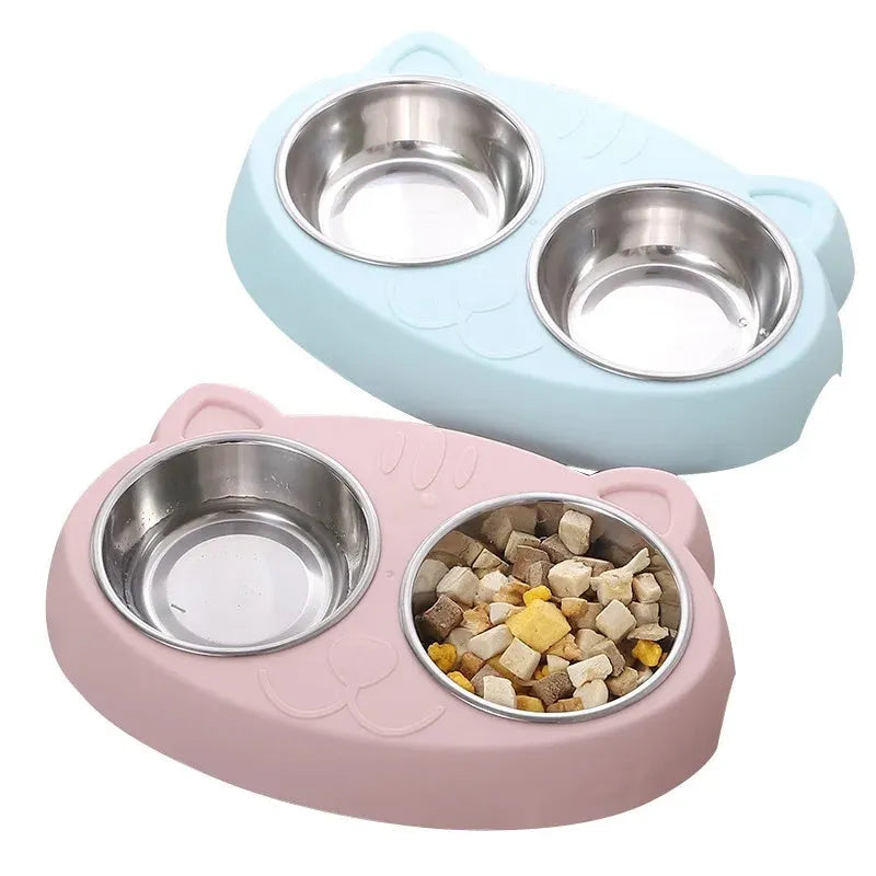 Blue macaron-shaped plastic pet feeder with two separate bowls for food and water.