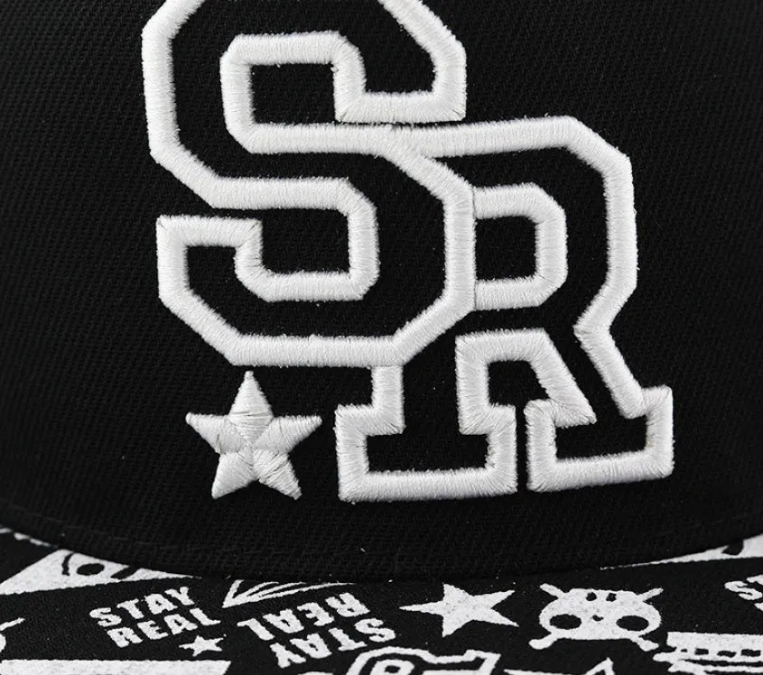 Black cotton baseball hat with white embroidered letters on the front, showing the dome crown shape.