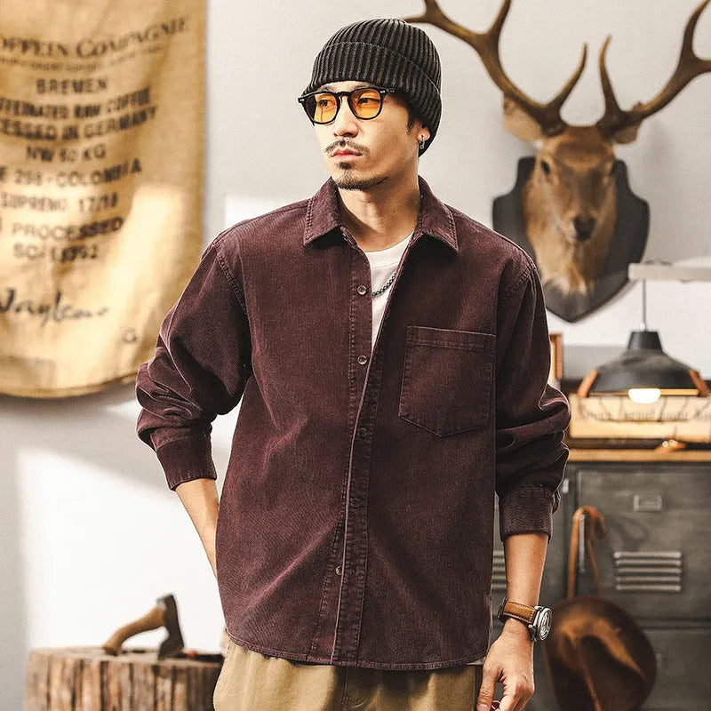 Men's loose-fit retro corduroy shirt jacket in red or black, showing long sleeves and textured fabric.