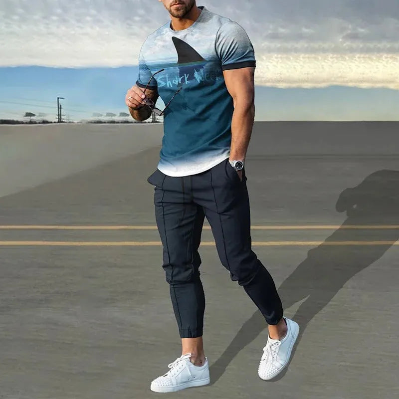 Man wearing a thin, short-sleeved printed pullover and matching trousers from a lightweight sport suit set.