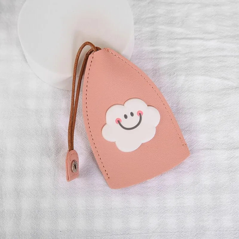 Colourful cartoon pull-out key protector case made from PU leather, showing a selection of fruit and animal designs.