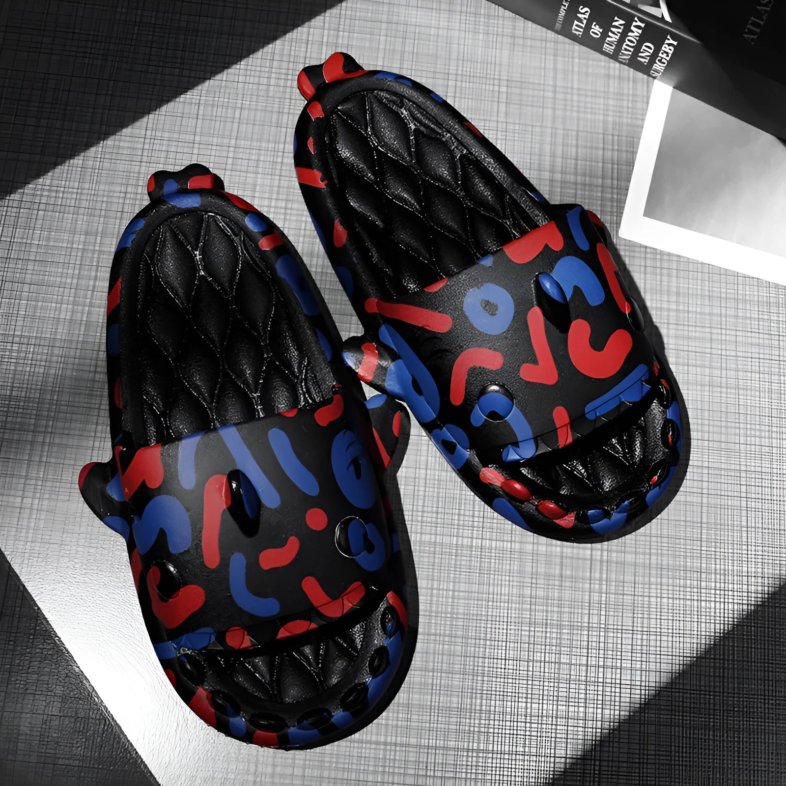 Cute shark design open-toe home slippers made from beige EVA material.